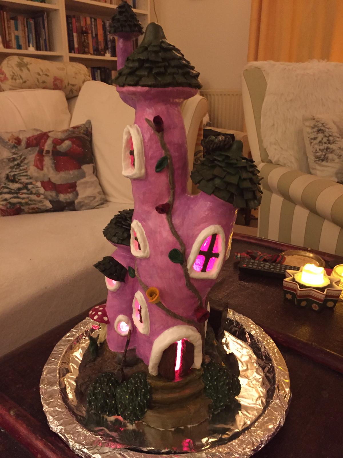 A finished fairy house lamp all lit up