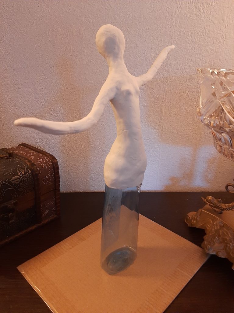 DIY Figurine made of waste plastic bottle: Covering body with modelling clay